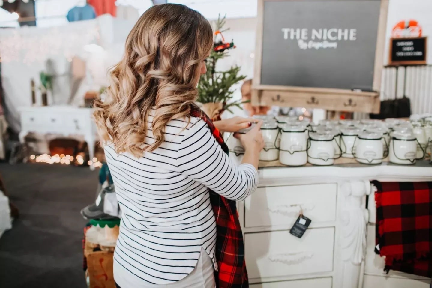 woman organizing holiday jars- home organization