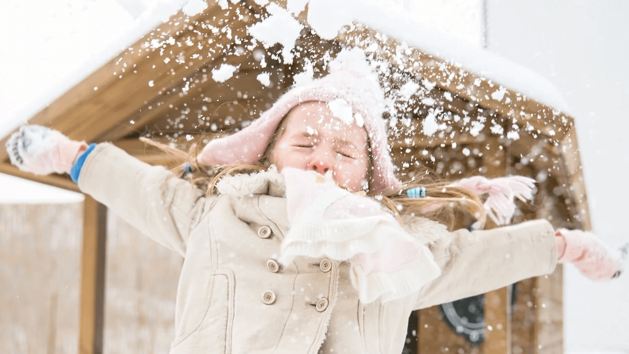 little girl playing in the snow