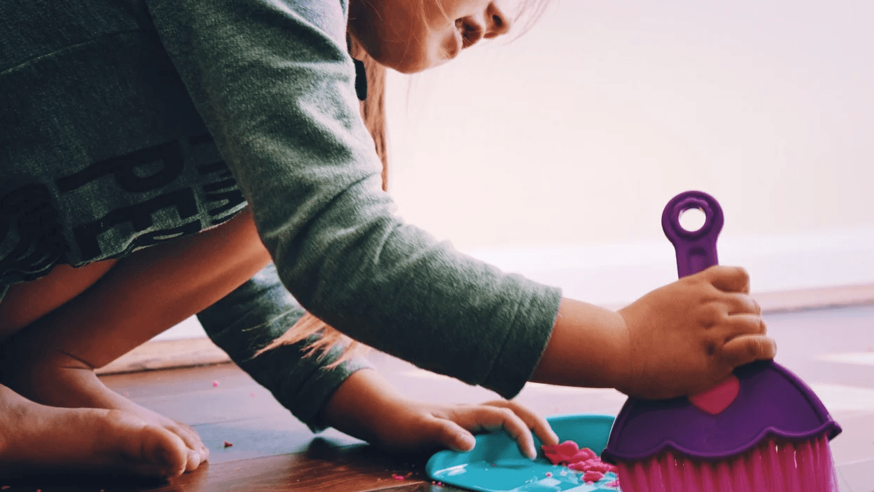 toddler sweeping the floor