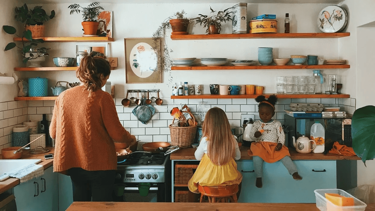 mom in the kitchen with two little girls