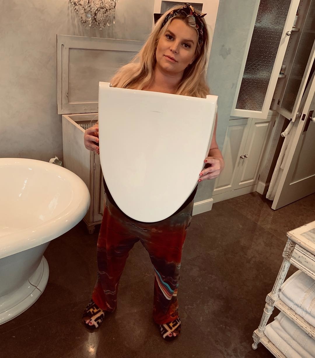 pregnant jessica simpson broke toilet featured Motherly