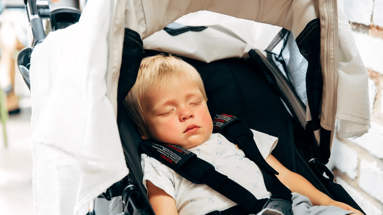 child napping in a stroller