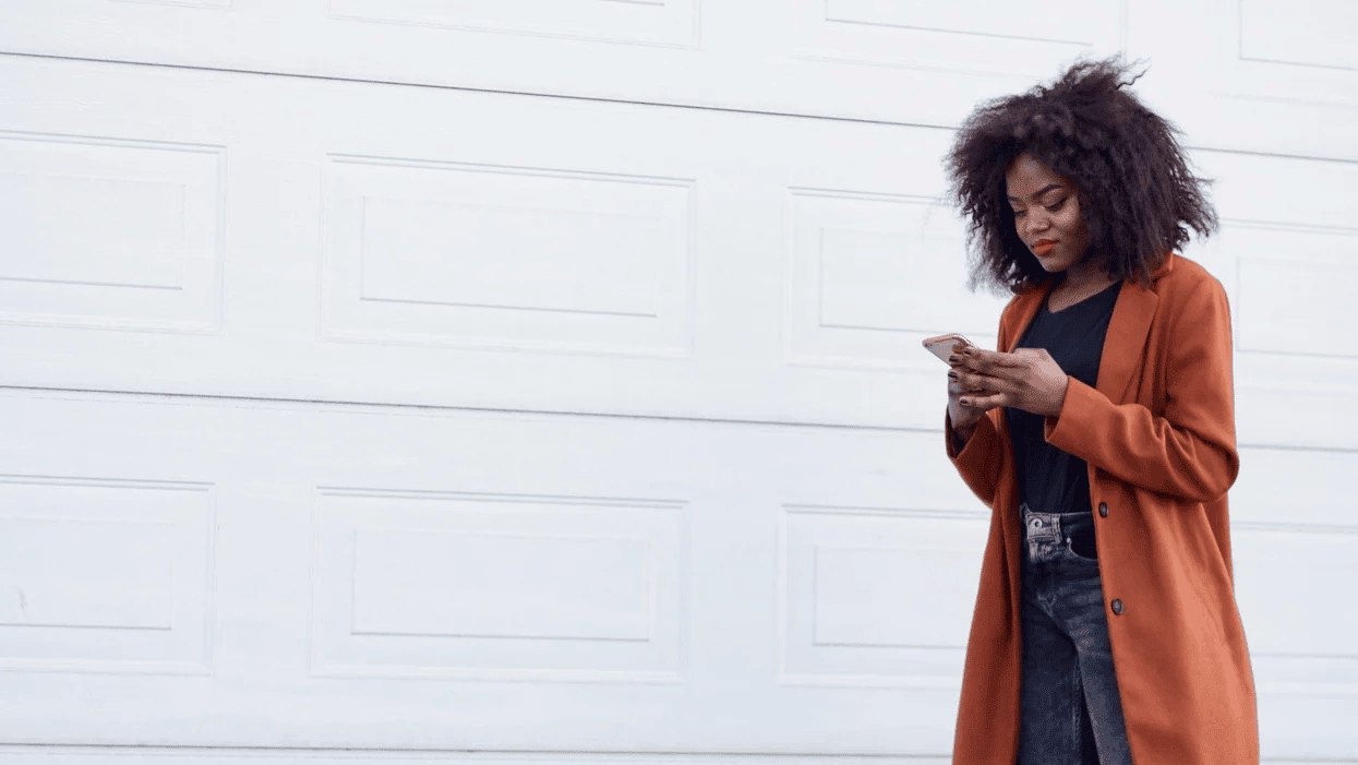 woman walking on her phone