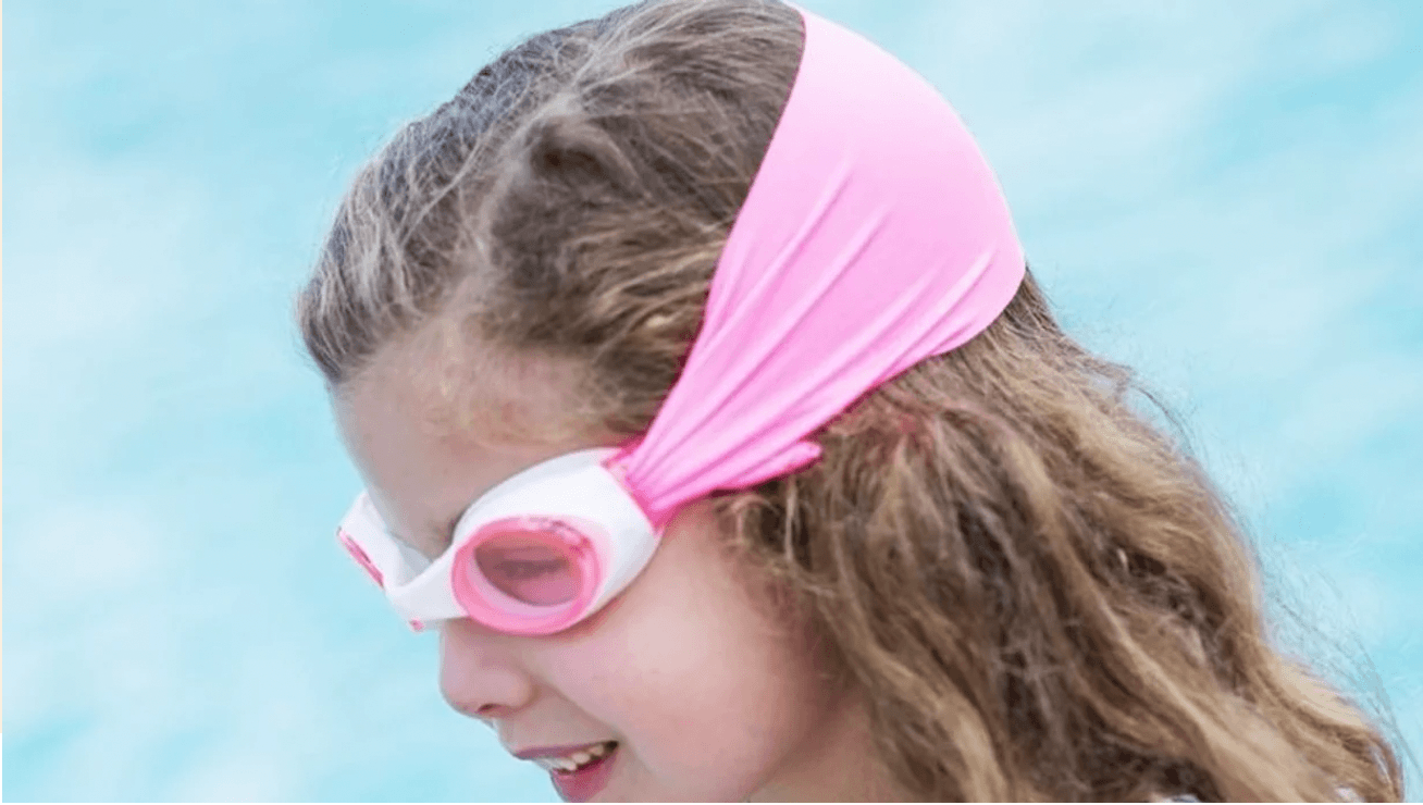child wearing swim goggles