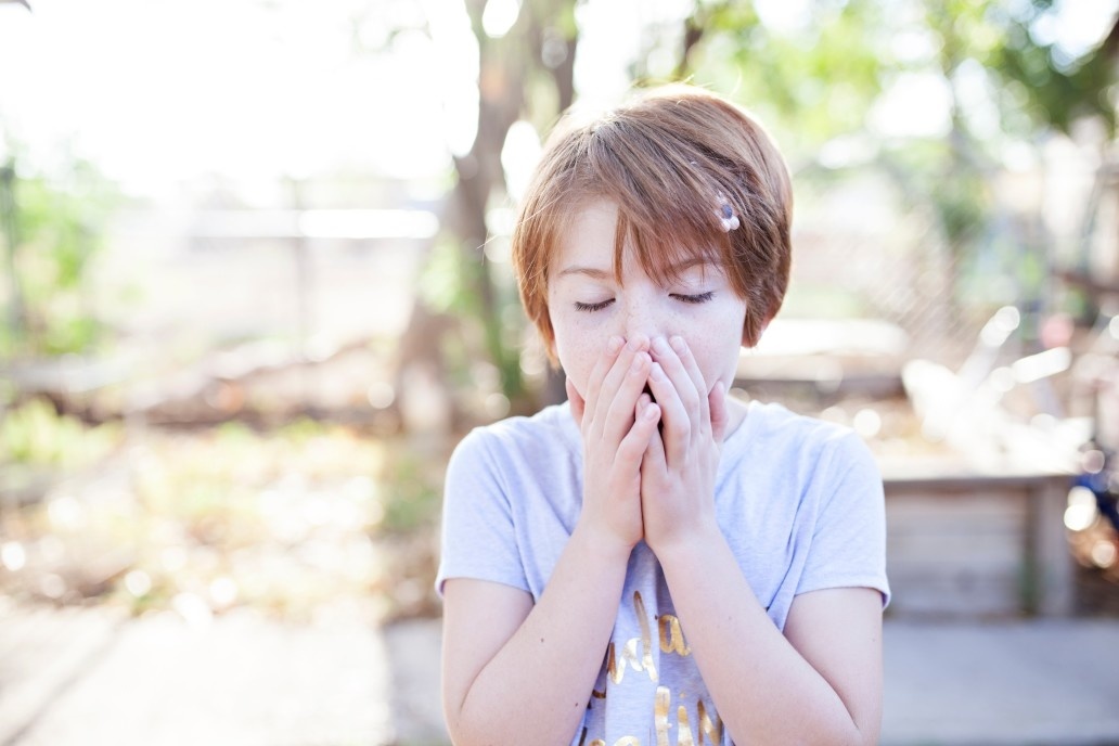 child about to sneeze outside - does my child have an allergy?