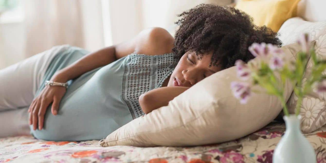 pregnant woman sleeping on her side