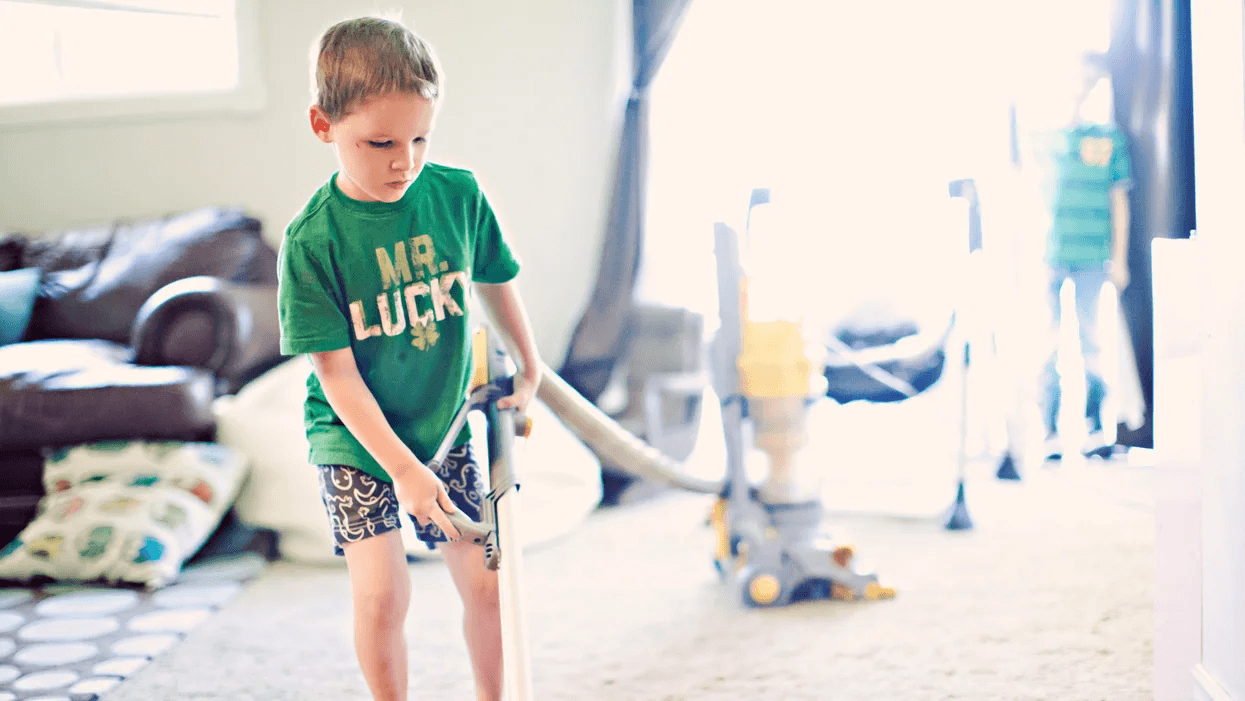 little boy running a vacuum