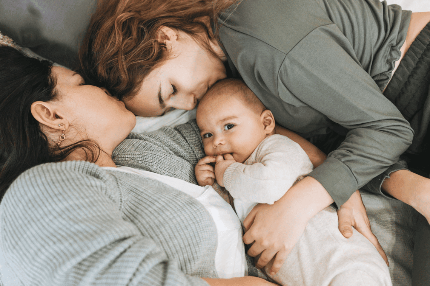 mom kissing baby and the other mom kissing the other woman- my baby