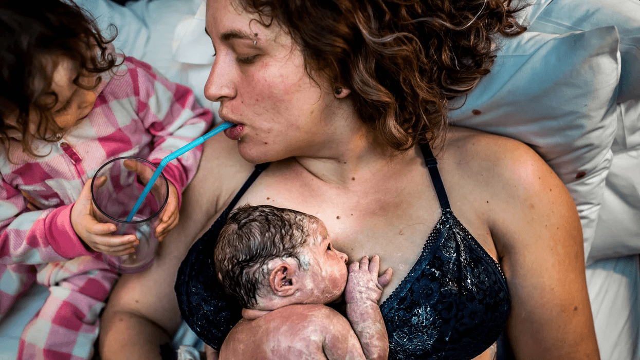 mom drinking a smoothie right after giving birth