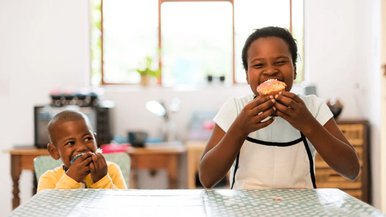 siblings eating Easter muffins