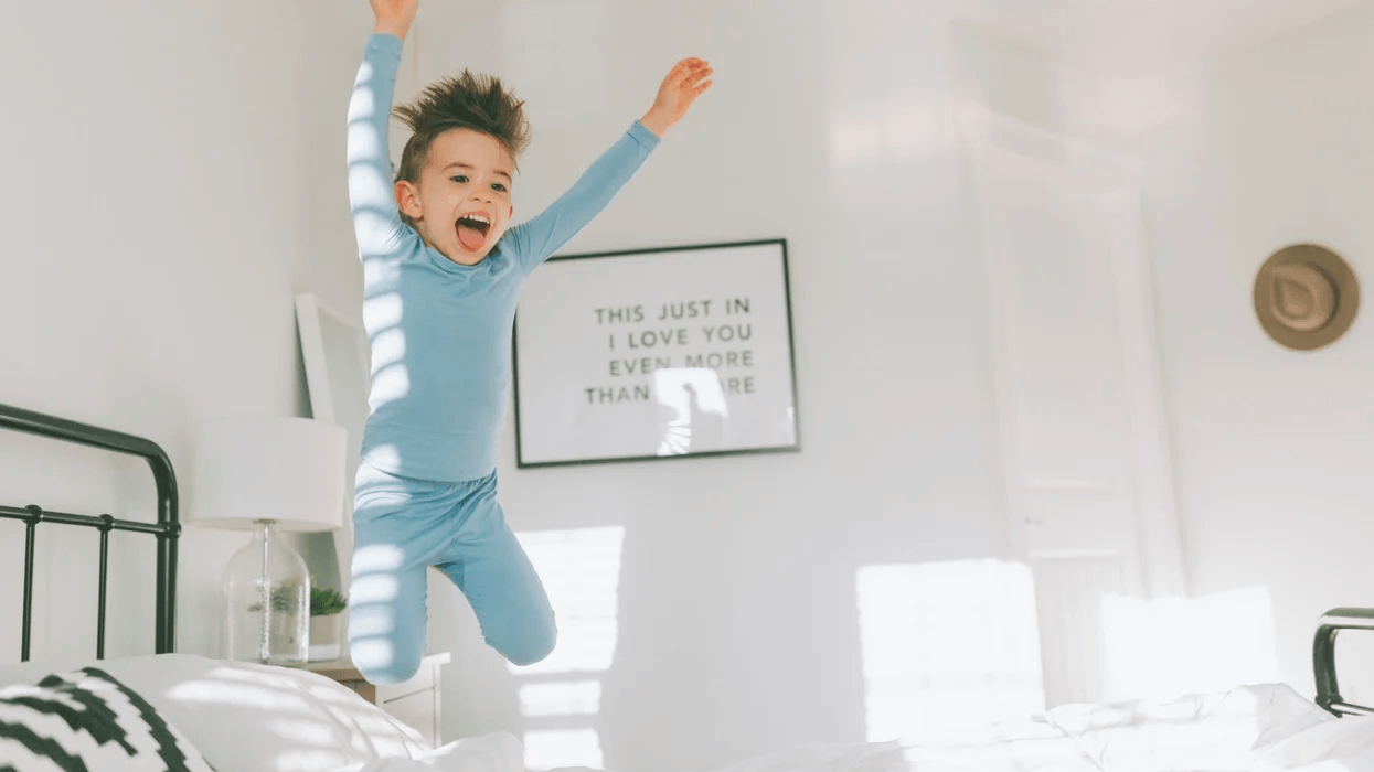 kid jumping on the bed