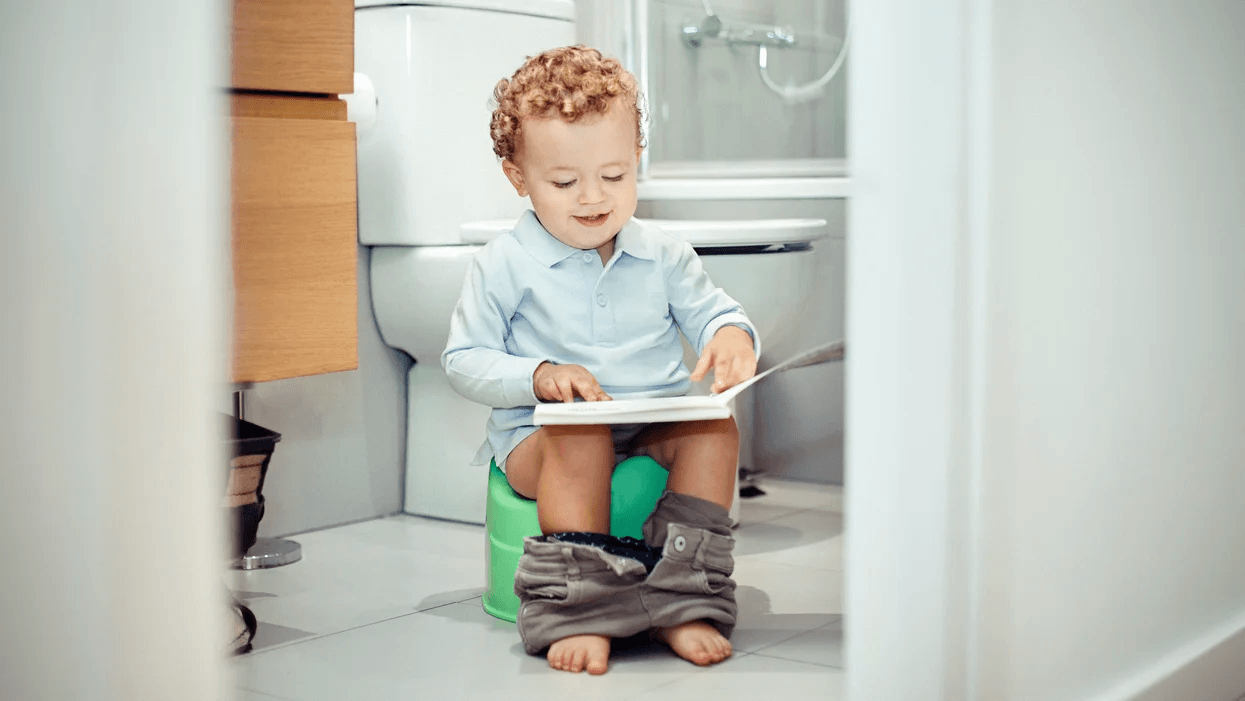 little boy on a toddler potty