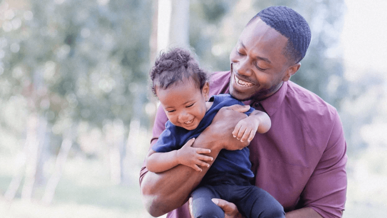 dad playing with little kid