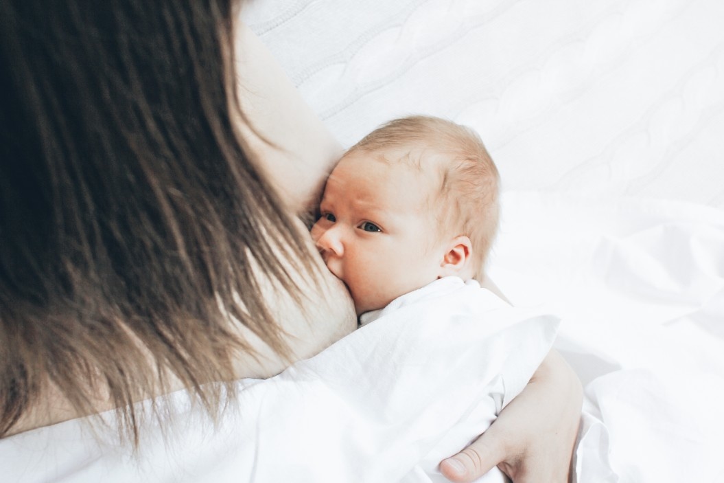 why does breastfeeding hurt featured Motherly