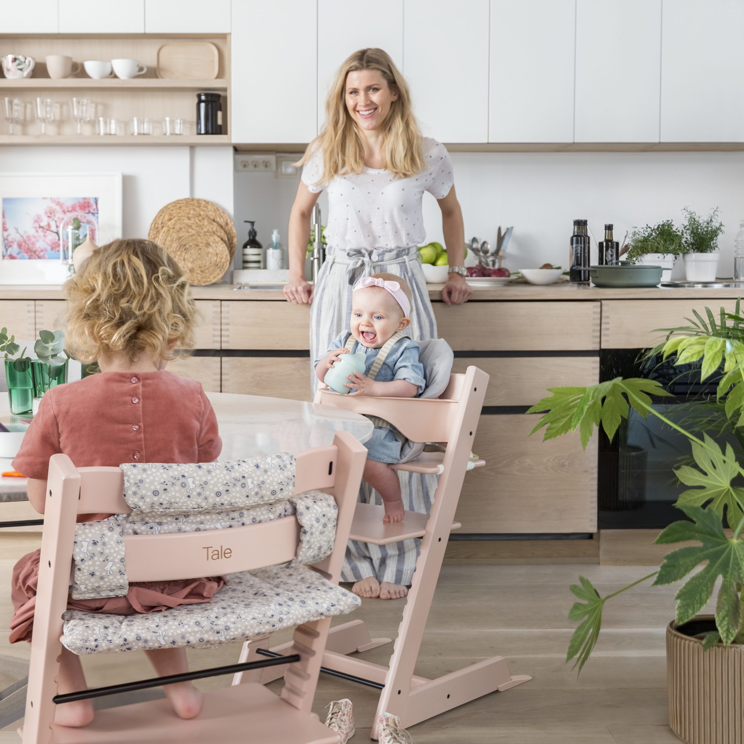 mom using one of the best high chairs for kids