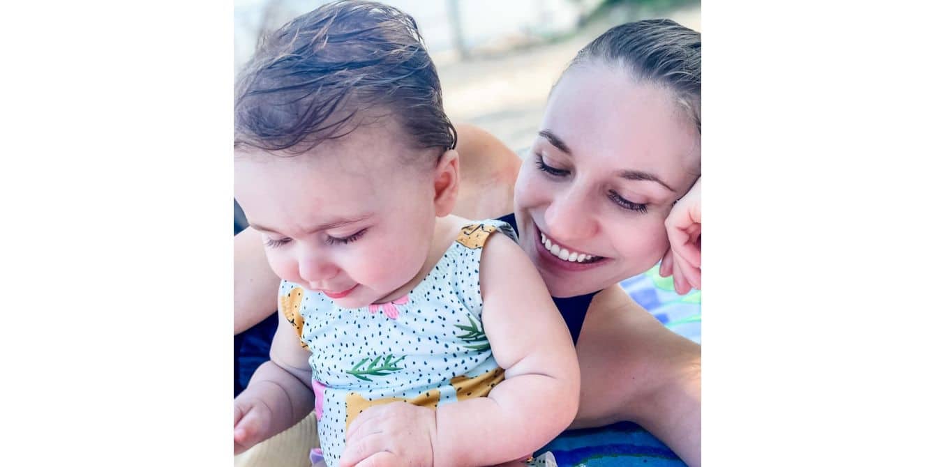 mom sitting at the pool with her baby-essay on coronavirus helped postpartum anxiety