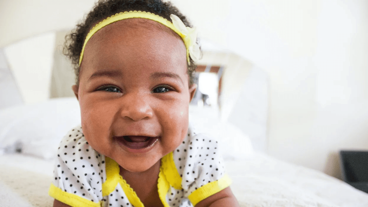 baby girl smiling at camera