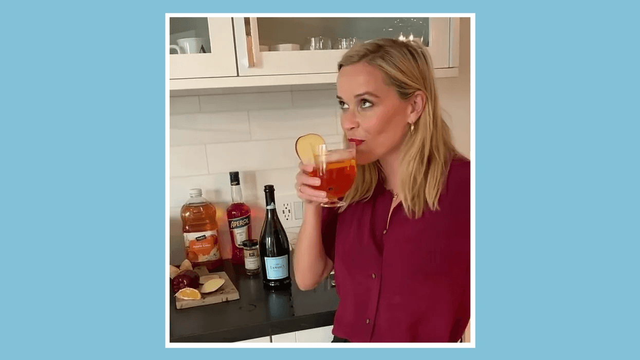 Reese Witherspoon drinking a cocktail