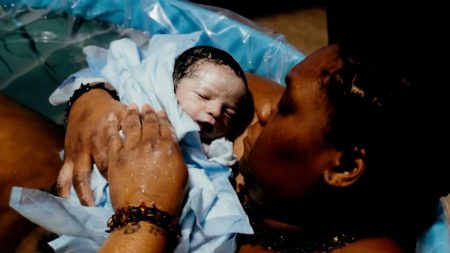 mom holding newborn baby