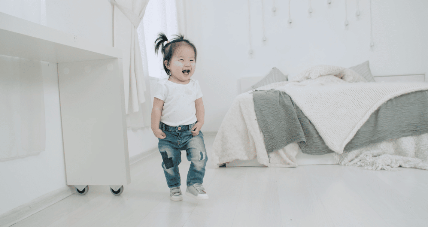 little girl playing in a bedroom