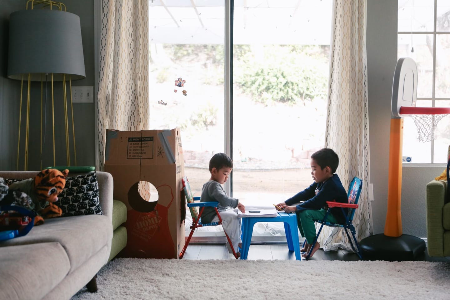 two kids playing on a table