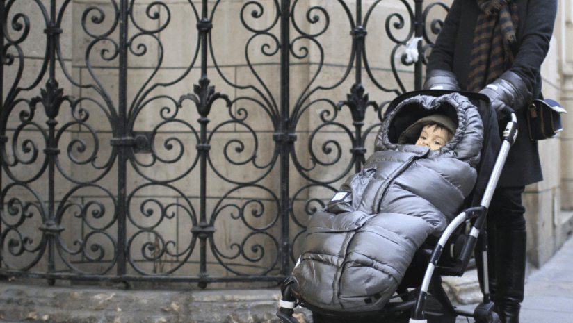 baby wearing stroller jacket on a walk