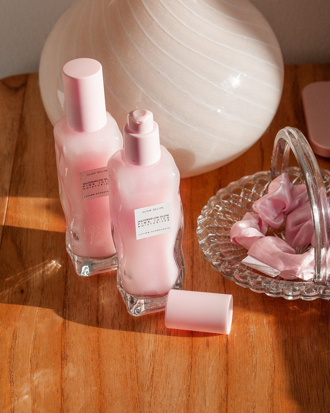 watermelon glow bottles on night stand