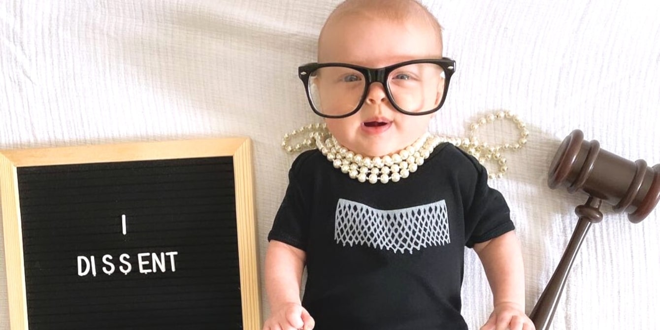 cute baby dressed as rbg with pearls and glasses on- famous women in history