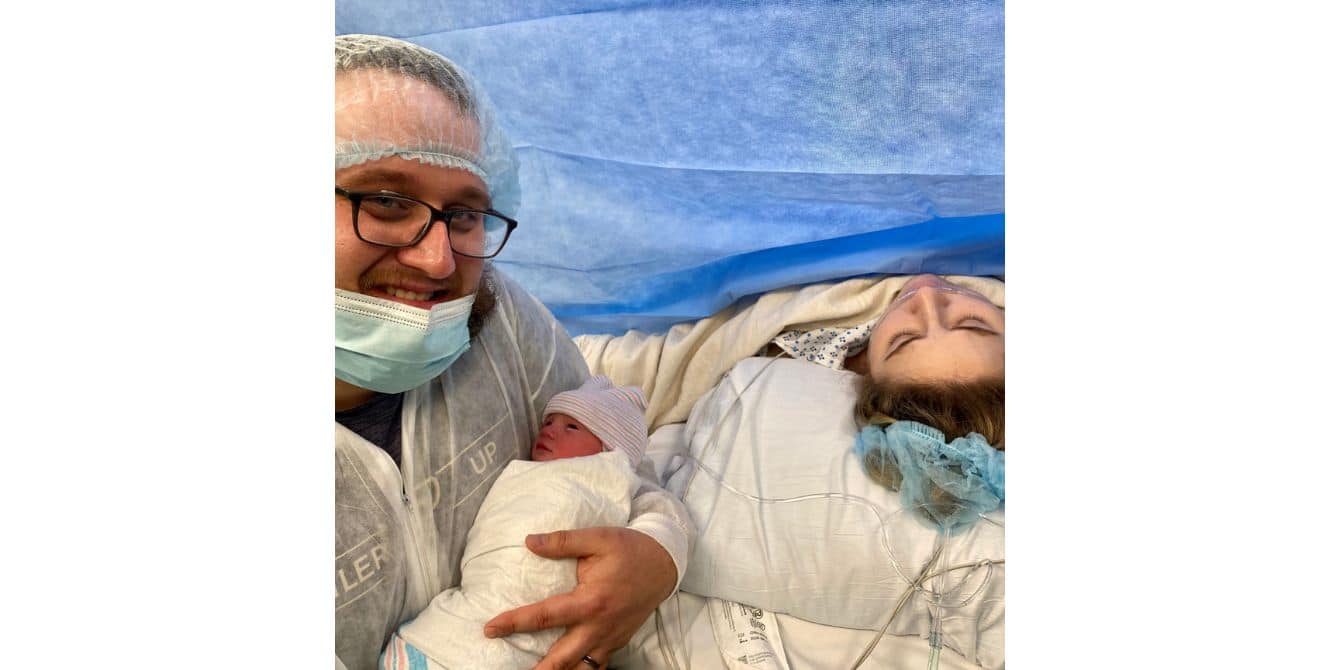 new dad and mom with newborn