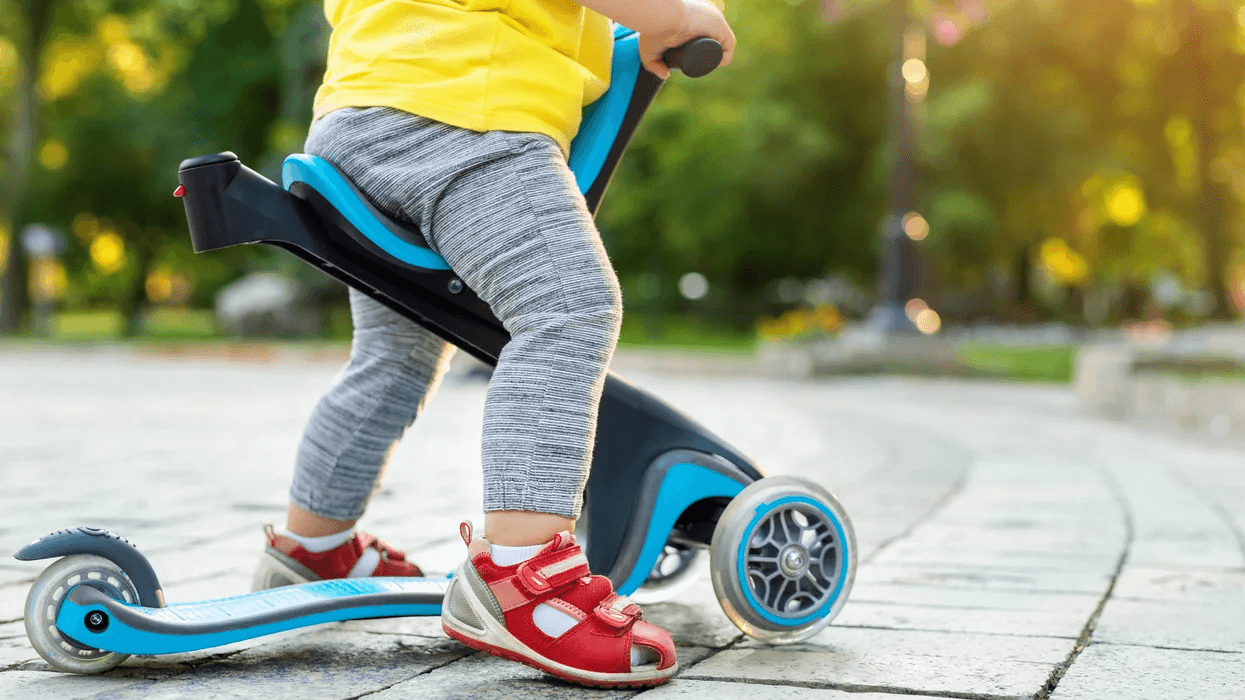 toddler on a scooter