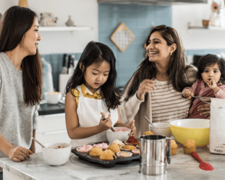 mothers with children makings cupcakes in kitchen Motherly