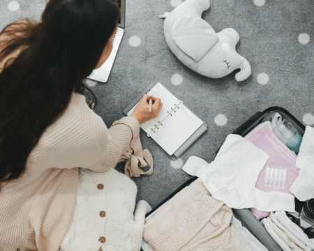 pregnant mom packing hospital bag for baby