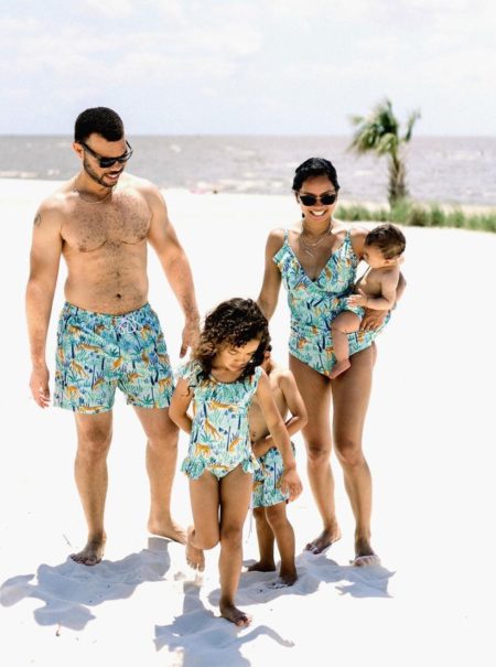 family in matching tiger bathing suits