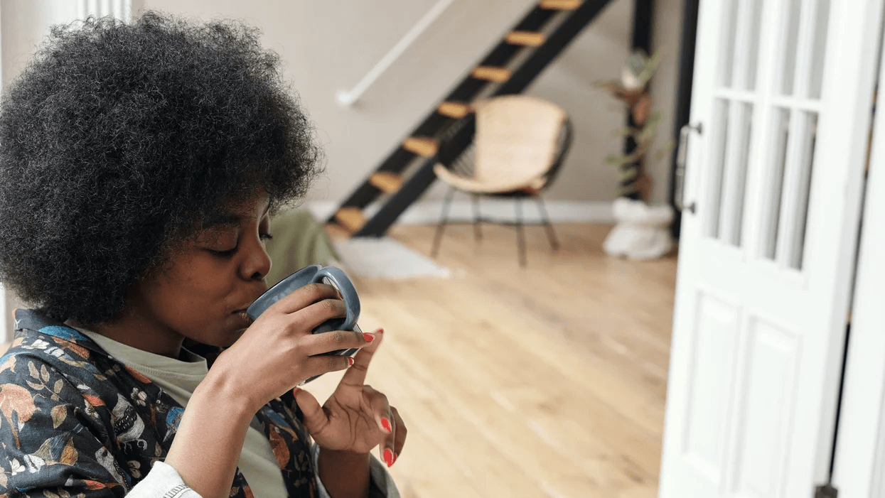 woman drinking a cup of tea