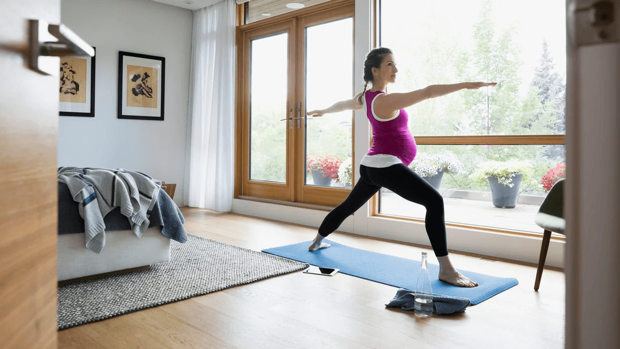 pregnant woman doing yoga