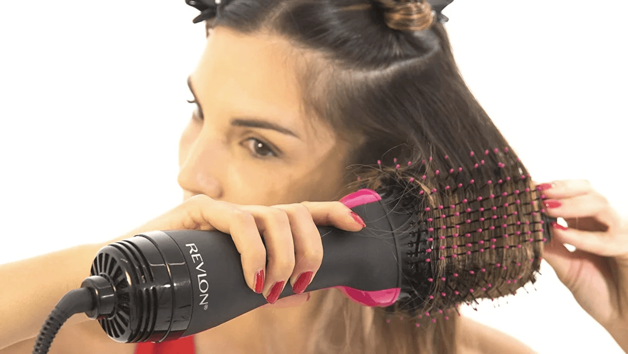 woman using revlon hair dryer