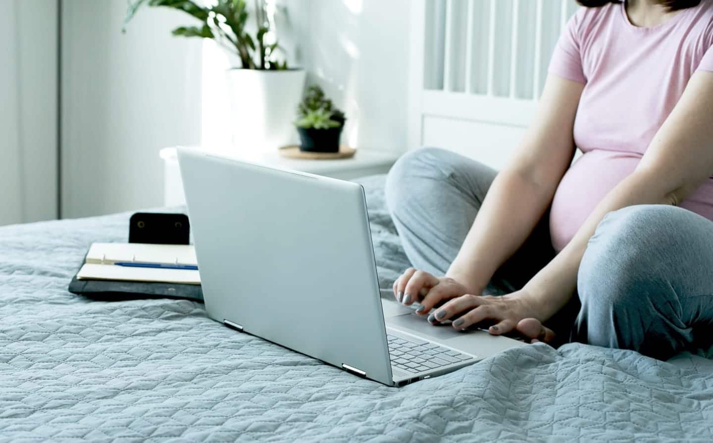 pregnant woman working on a computer