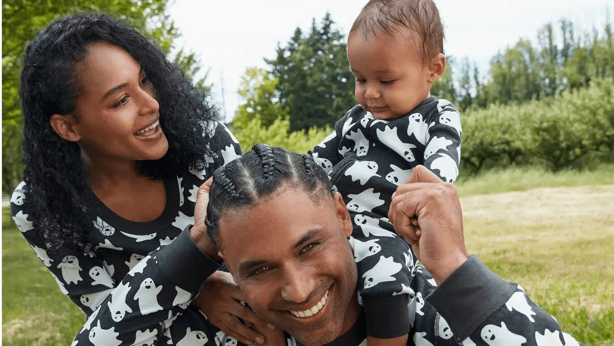 family wearing matching halloween pajamas