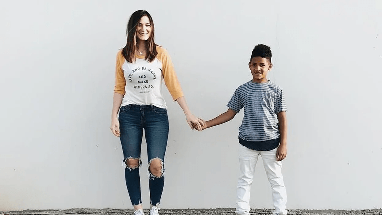 mom holding hands with son
