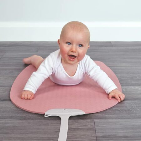 baby on pink yoga mat