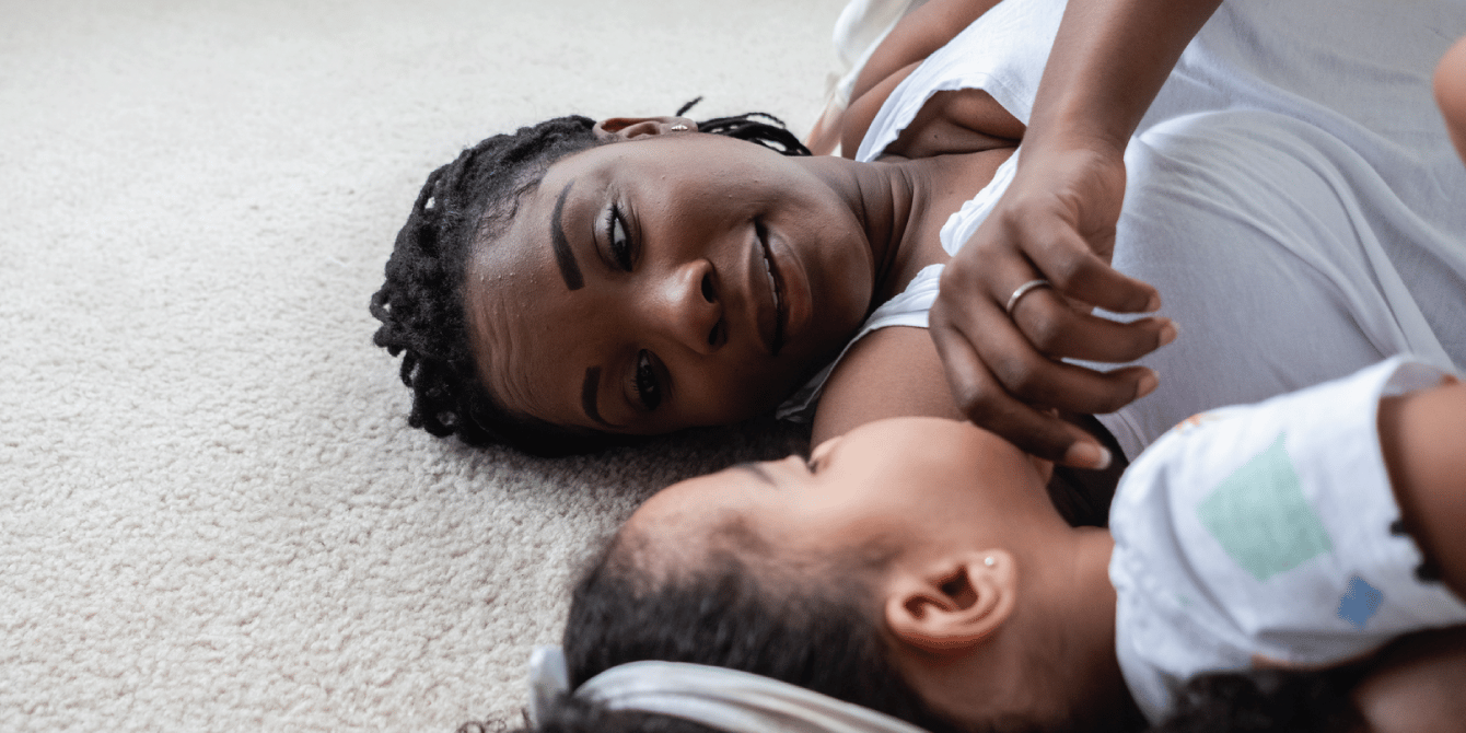 mom and daughter laying on the floor - mental health tips for kids