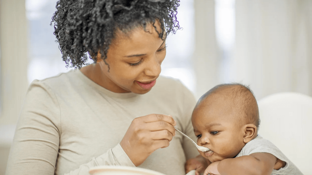 mom feeding baby food