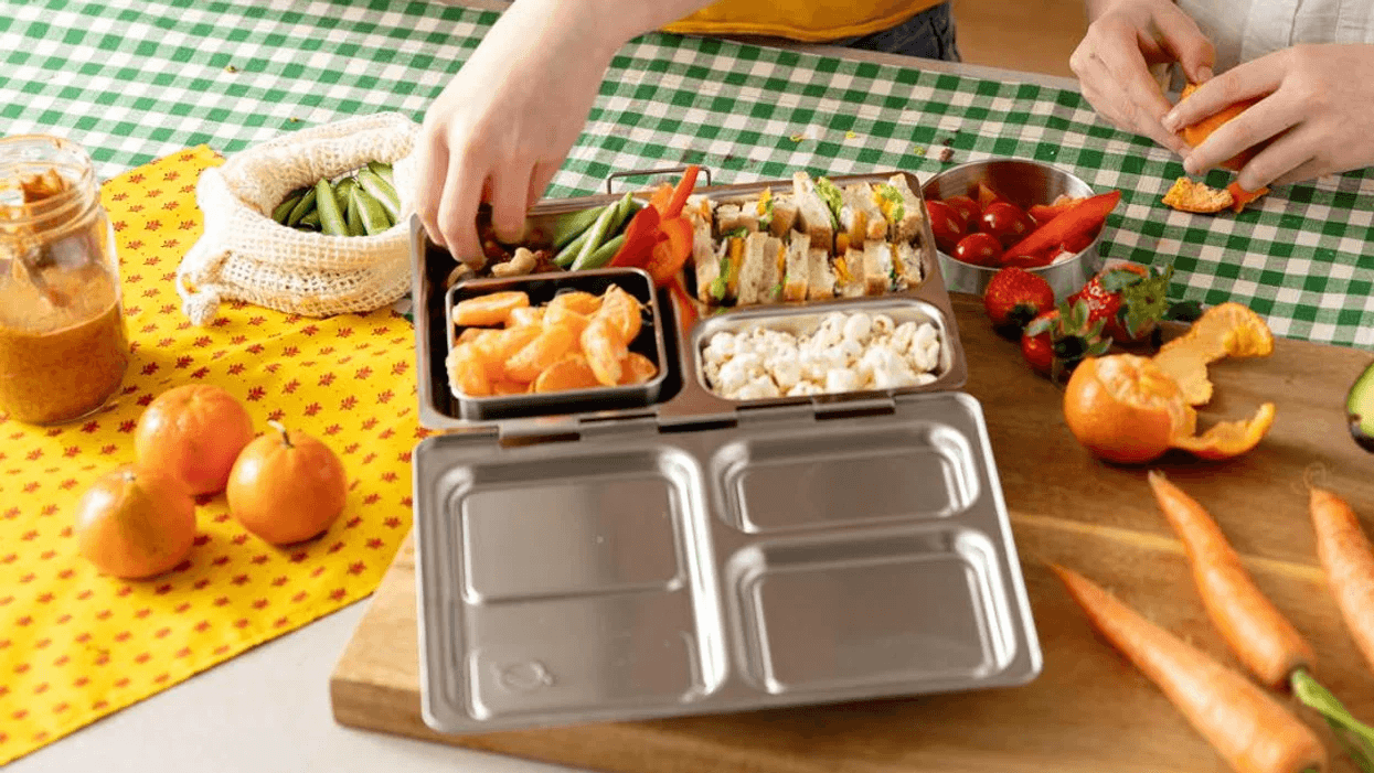 child eating out of a bento box