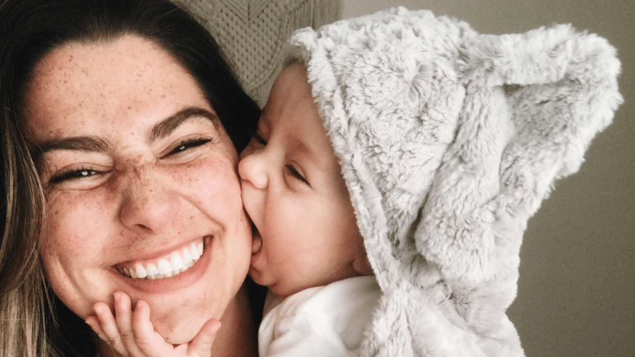 baby kissing moms face - 9-month milestones for baby