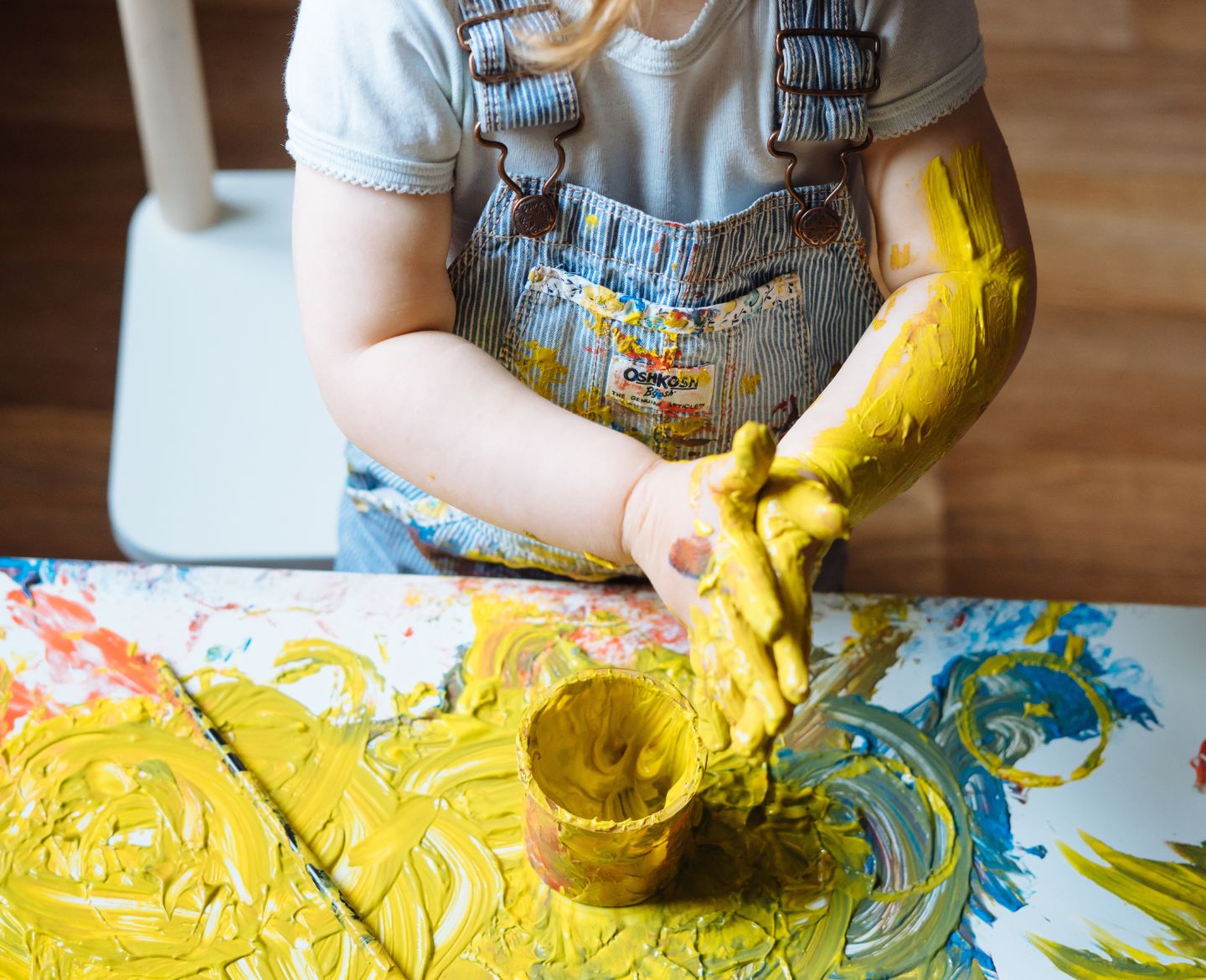 little girl playing with paint