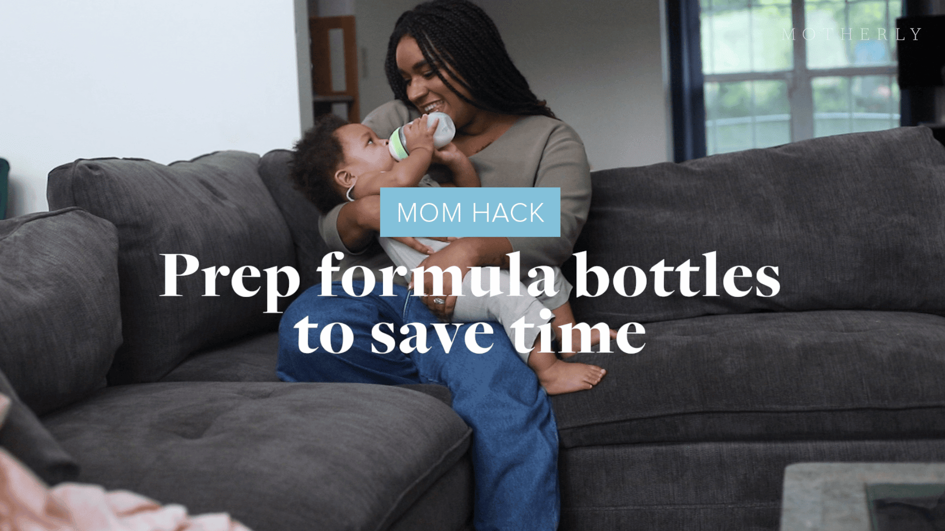 mom-feeding-baby-a-bottle-on-the-couch