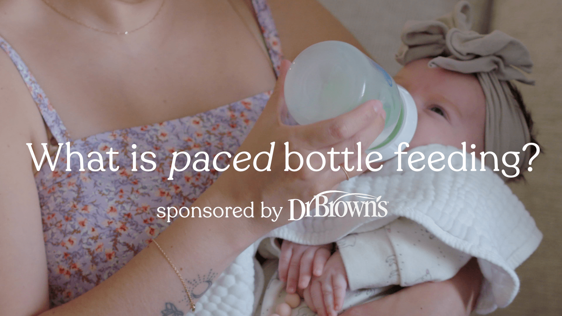 mom-holding-baby-taking-a-bottle