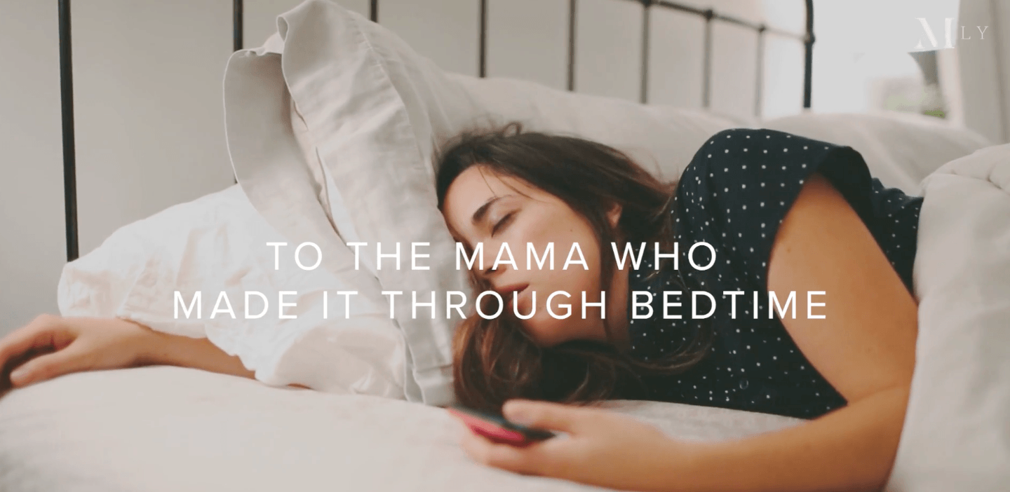 video-screenshot-of-exhausted-mom-sleeping-in-bed