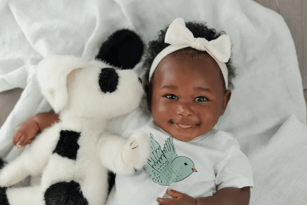 cute baby holding stuffed animal