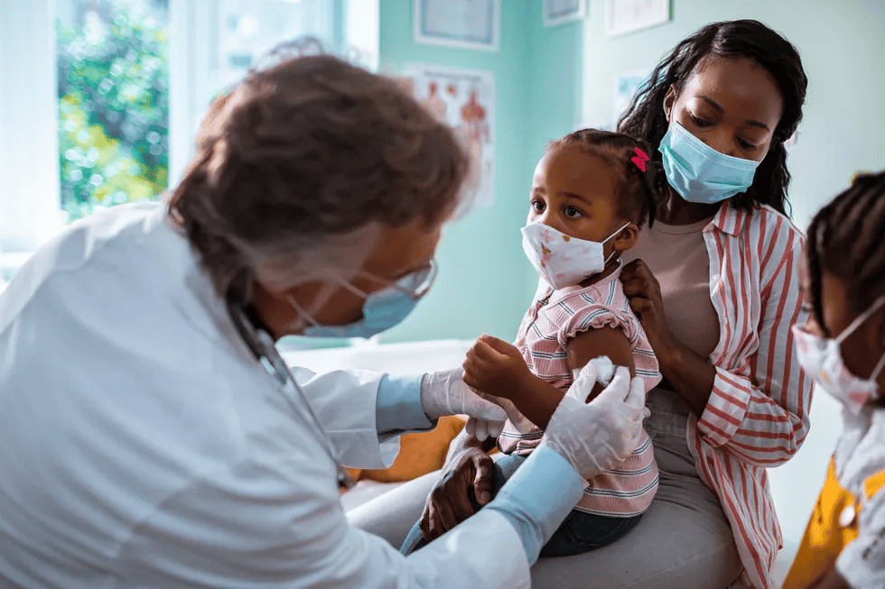 child getting vaccinated at pediatrician s office Motherly